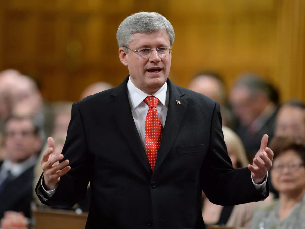 Prime Minister Stephen Harper answers questions in the House of Commons on Parliament Hill on Tuesday, Nov. 26, 2013. Harper is defending staff members involved in the Mike Duffy expense-repayment deal. (The Canadian Press/Sean Kilpatrick)