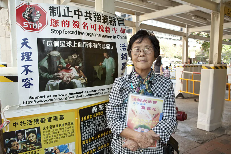 Ms Liao has volunteered, helping people renounce the CCP, outside of Tsim Sha Tsui East in Hong Kong for 9 years. (Epoch Times)