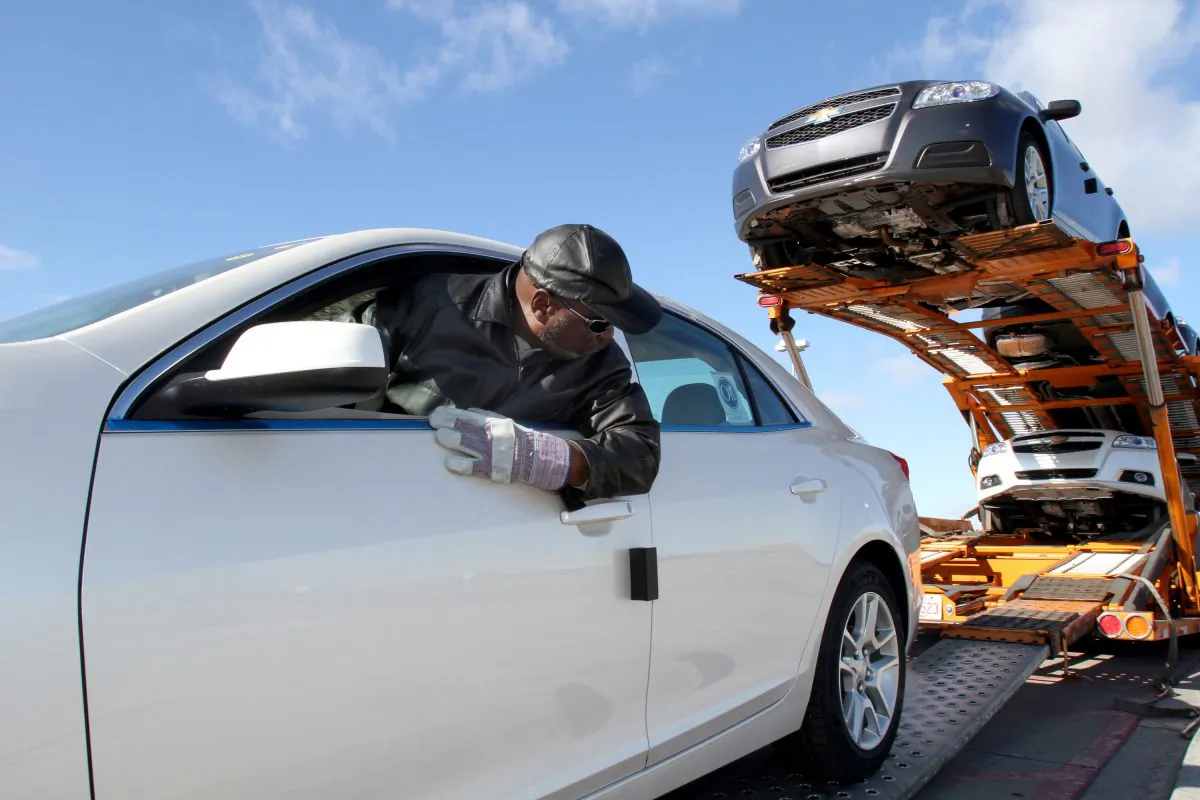 A 2013 Chevrolet Malibu Eco is loaded onto a truck at a General Motors plant in Fairfax, Kan., Jan. 18, 2012. (Susan McSpadden/Chevrolet via Getty Images)