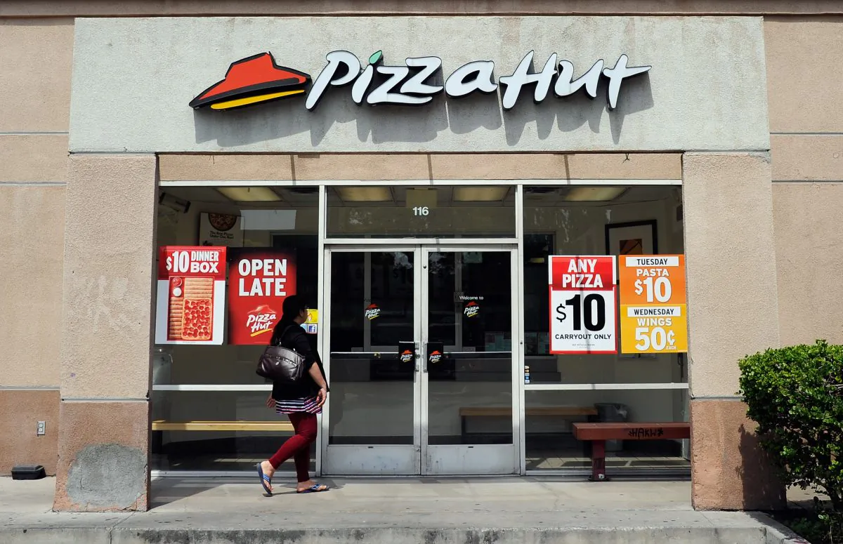 A customer walks in to a Pizza Hut restaurant in Los Angeles, Calif., on April 19, 2012. (Kevork Djansezian/Getty Images)