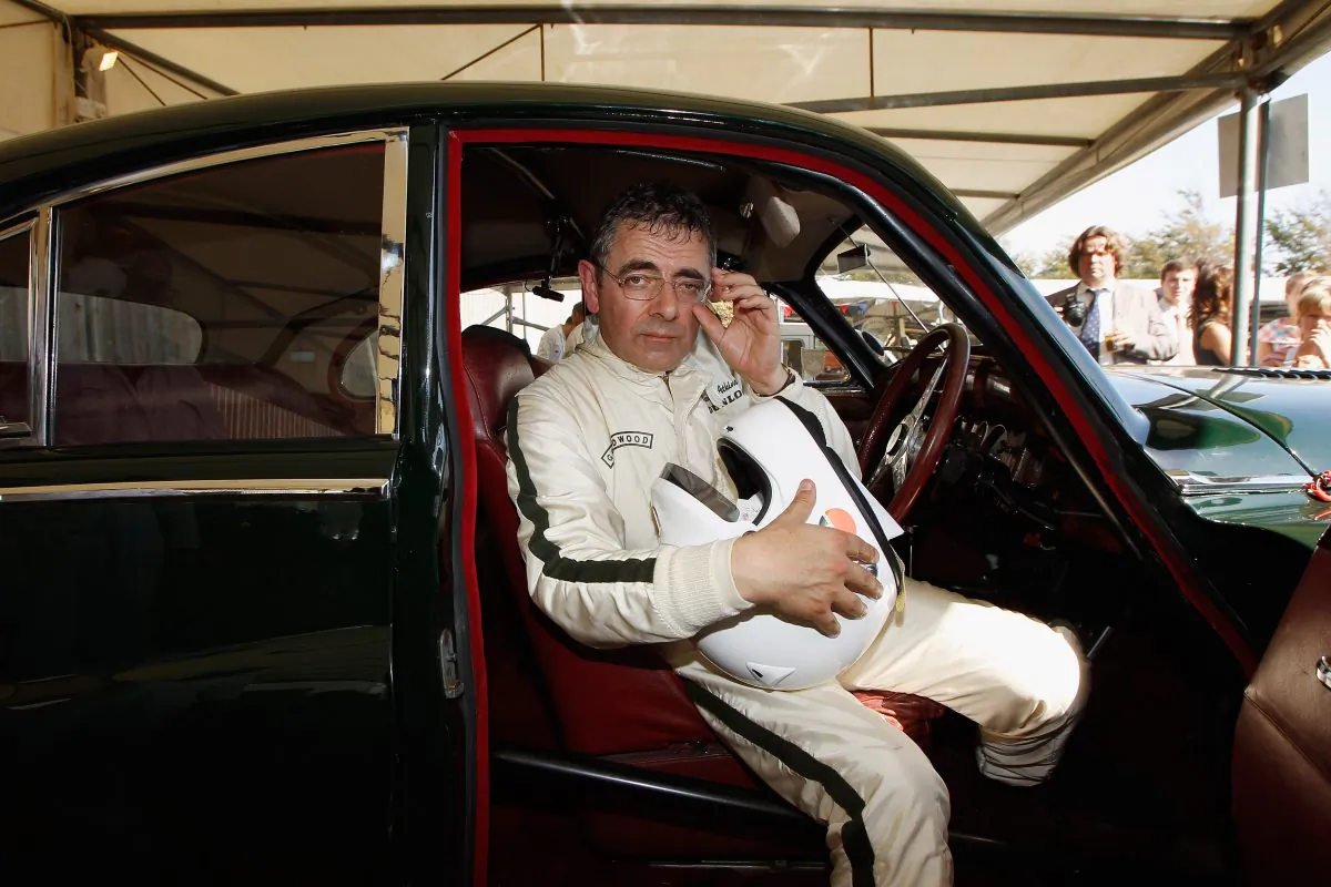 Actor Rowan Atkinson sits in his car after the St. Mary's trophy during the Goodwood Revival 2012 in Chichester, UK, on Sept. 15, 2012. (Andreas Rentz/Getty Images)