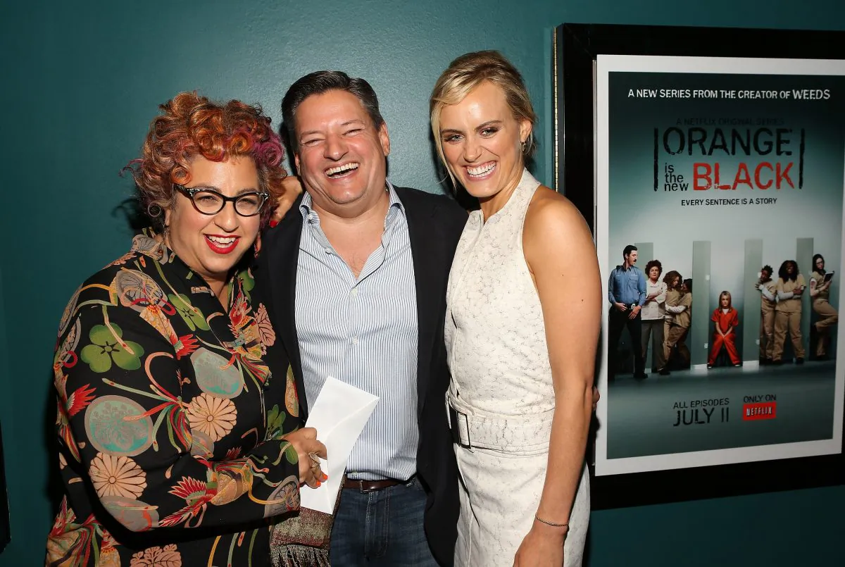 (L-R) 'Orange Is The New Black' creator and executive producer Jenji Kohan, Netflix Chief Content Officer Ted Sarandos, and actress Taylor Schilling attend a special screening of the show in Santa Monica, Calif., June 17. (Jesse Grant/Getty Images for Netflix)