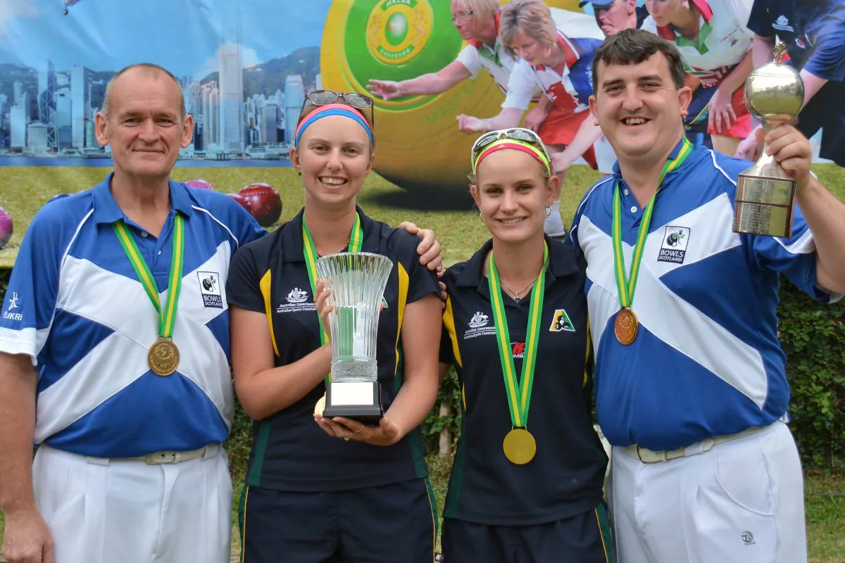 Hong Kong International Bowls Classic Pairs 2013 champions ... Australian youngster Kelsey Cottrell (second from left) and Carla Odgers proudly display their Women’s trophy with the Men’s winners from Scotland, Robert Grant (Left) and Iain McLean. (Stephanie Worth)