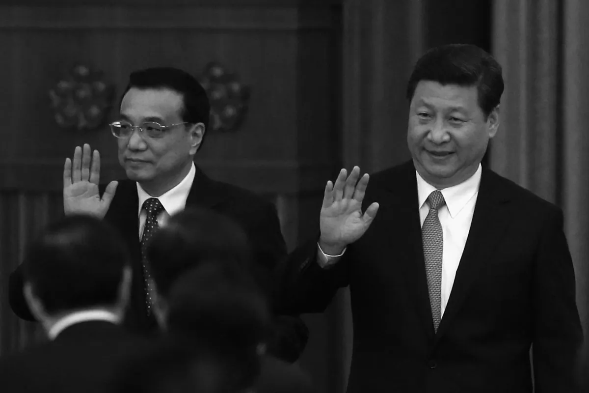 Chinese Communist Party (CCP) head Xi Jinping (Right) and Premier Li Keqiang (Left) wave to guests as they arrive for a dinner marking the 64th anniversary of the founding of the People's Republic of China at the Great Hall of the People on Sept. 30, 2013 in Beijing, China. The two were responsible for issuing a collection of reforms at the Third Plenum of the 18th Central Committee, which are meant to rescue the CCP from crisis. (Feng Li/Getty Images)