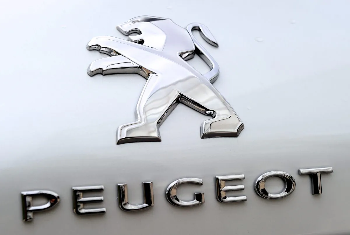 The Peugeot logo on a Peugeot 308 at the new assembly line inauguration in Douvrin, norther France, Oct. 29.(PHILIPPE HUGUEN/AFP/Getty Images)