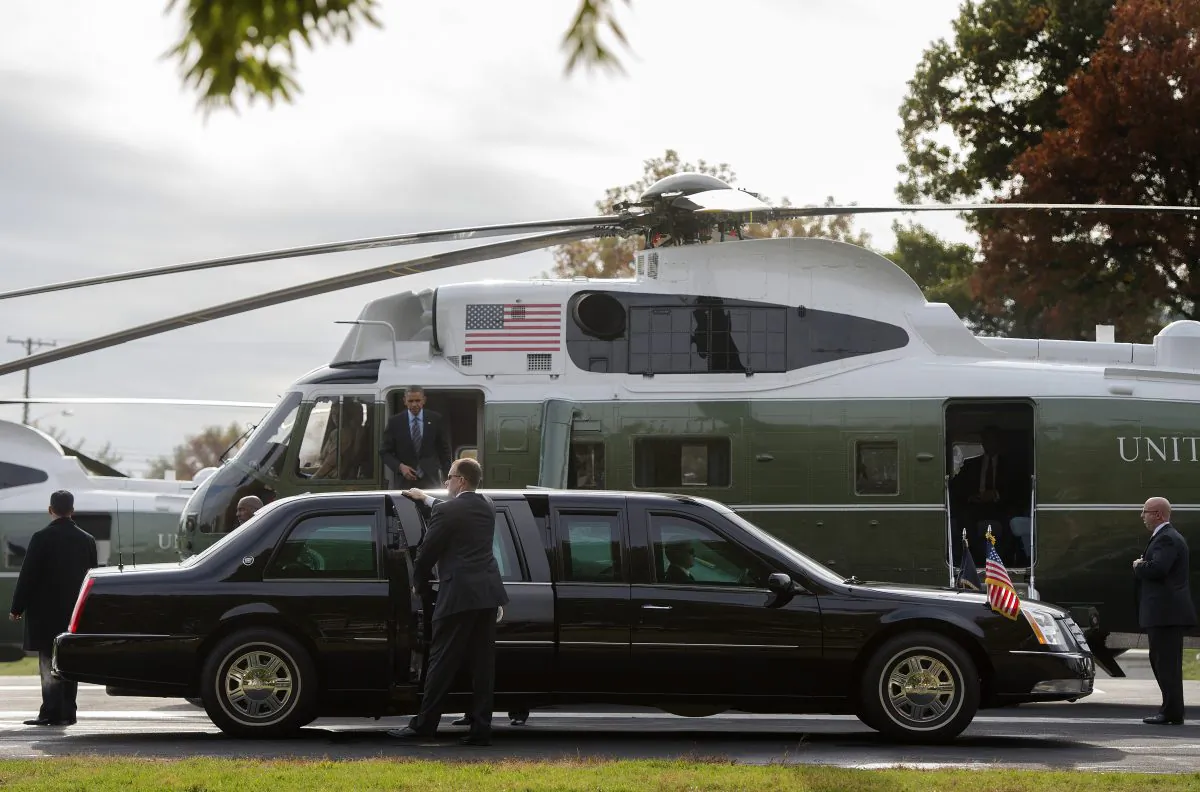 US President Barack Obama (C) walks off Marine One as he arrives at Walter Reed National Military Medical Center in Bethesda, Maryland on November 5, 2013. The standard for securing presidential safety has been upgraded with each administration, and the trend can be traced back exactly 50 years, to the day President John F. Kennedy cruised through downtown Dallas in a rather ordinary 1961 Lincoln Continental. 
(JIM WATSON/AFP/Getty Images)