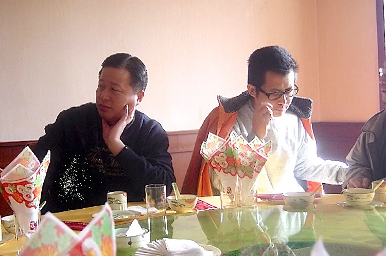 Chinese human rights lawyers Gao Zhisheng (L) and Guo Feixiong pictured in a restaurant in January 2006. (Epoch Times)