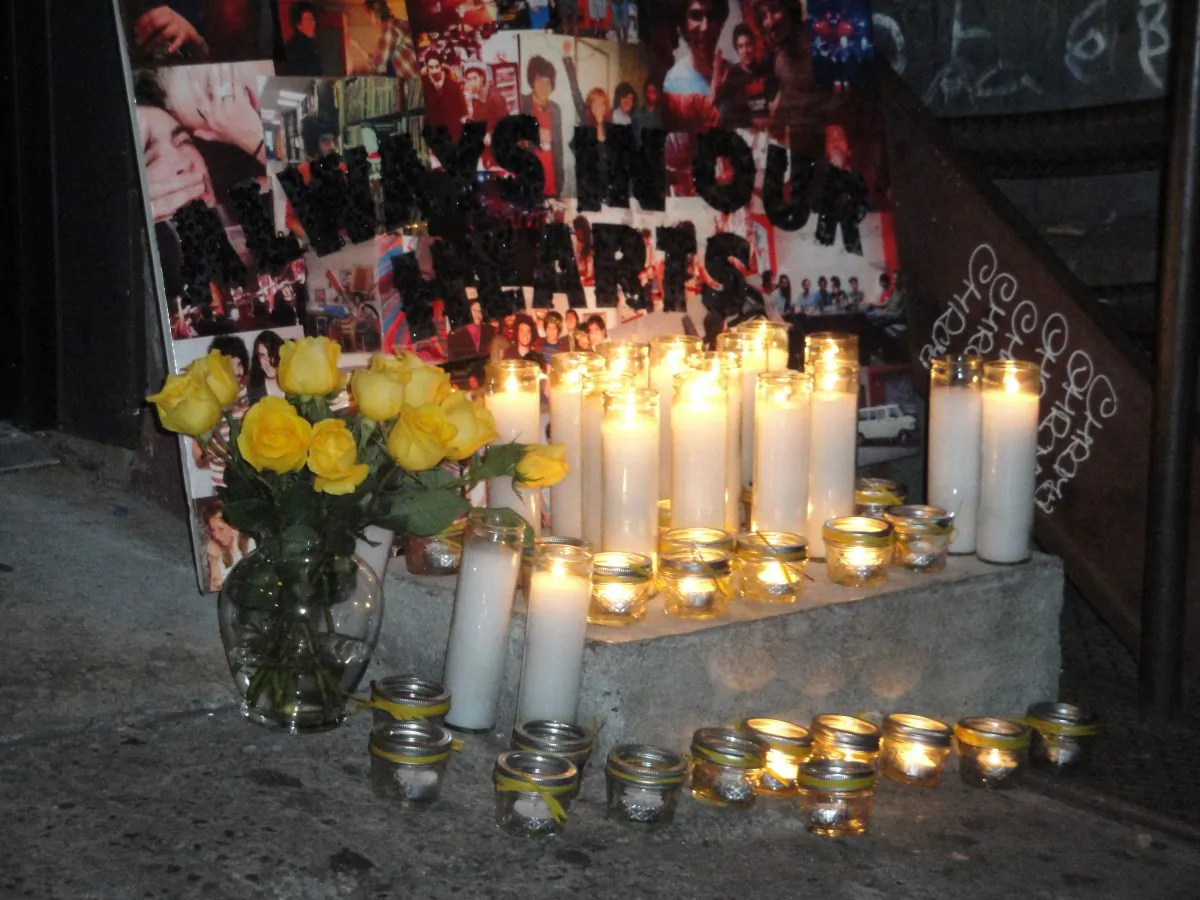Friends and family of slain Yellow Dogs band members gather at a candlelight vigil outside Cameo Gallery on North Sixth Street in Williamsburg, Brooklyn, Nov. 18, 2013. (Sarah Matheson/Epoch Times)