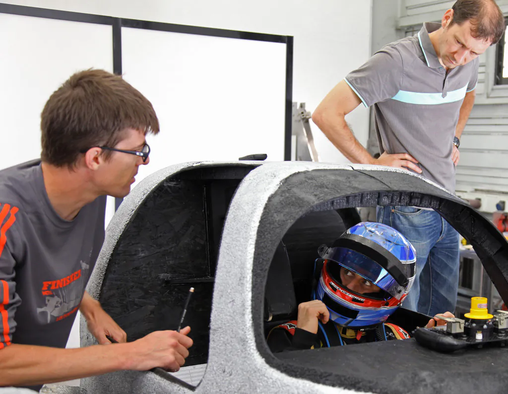 Nicolas Prost sits in a full-scale mock-up of the R-One cockpit to check driving position and lines of sight. (Rebellion Racing)