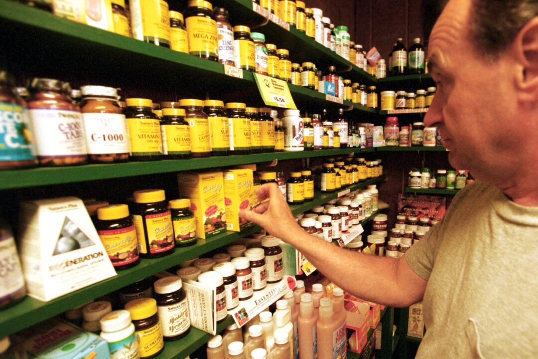 A customer looks at vitamins at Green Street Natural Foods in Melrose, Mass., on July 10, 2001. (Darren McCollester/Getty Images)