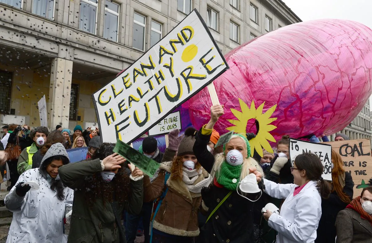 Young environmentalists from international organizations protest in front of the Polish Ministry of Economy in Warsaw, where the COP 19 climate summit is taking place, Nov. 18, 2013. Canada has placed last among wealthy countries in an OECD ranking for environmental protection. (Janek Skarzynski/AFP/Getty Images) 