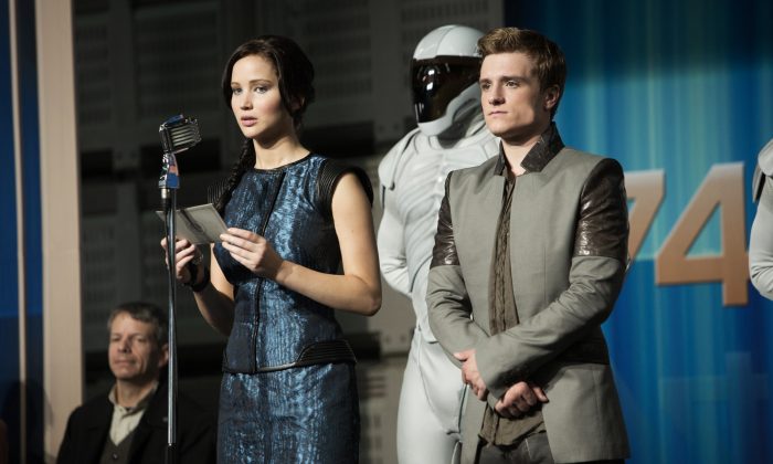 Jennifer Lawrence, left, as Katniss Everdeen and Josh Hutcherson as Peeta Mellark in a scene from the film, "The Hunger Games: Catching Fire." (AP Photo/Lionsgate, Murray Close)