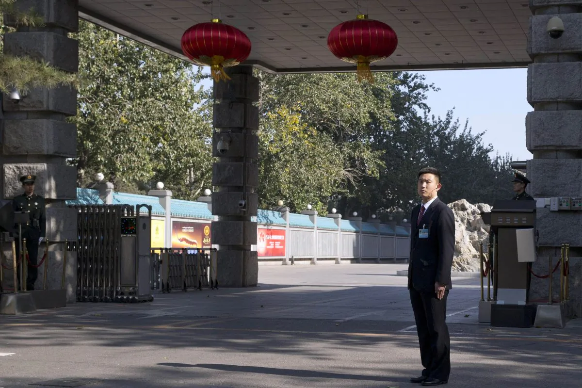 Security personnel on Nov. 7, 2013 guard the entrance to the military-controlled Jingxi Hotel, where the Third Plenum of the Central Committee, a major Communist Party meeting, is being held in Beijing. The meeting goes from Nov. 9-12 and will be used to announce new economic policies. (AP Photo/Ng Han Guan)