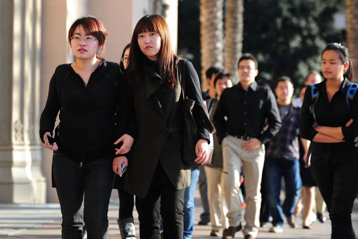 USC students on their way to attend a memorial service in Los Angeles, Calif., on April 18, 2012. (Frederic J. Brown/AFP/Getty Images)