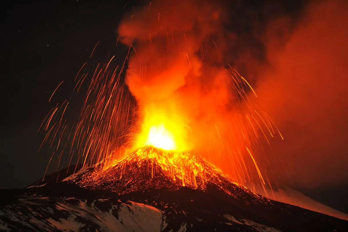 Mt. Etna, Europe's most active volcano, spews lava during an eruption as seen from Acireale, near the Sicilian town of Catania, Italy, on Nov. 16, 2013. It continues to erupt on November 18, along with several other volcanoes around the world. (AP Photo/Carmelo Imbesi)