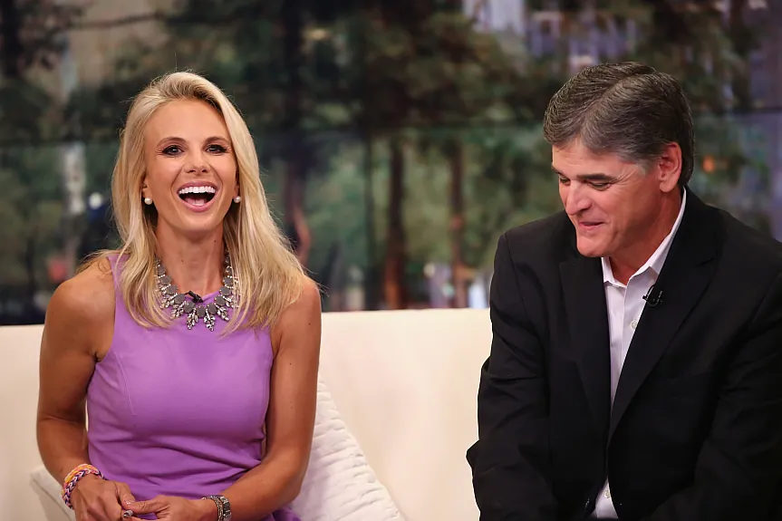 Partisan news pundits like Elisabeth Hasselbeck (L) and Sean Hannity (R), are blamed for polarizing America and breeding misinformation. But according to a new book, these shows have very little influence on the public at large. (Photo by Neilson Barnard/Getty Images) 
