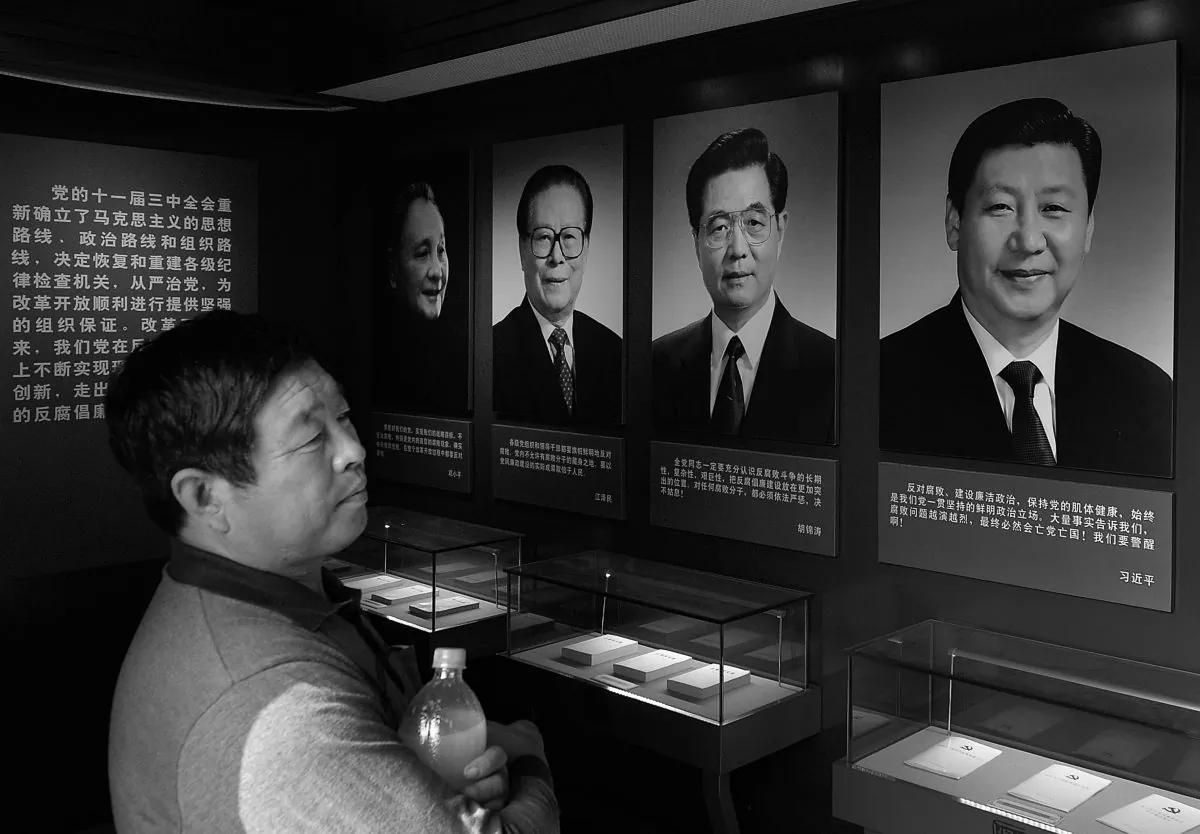 Portraits of recent Chinese Communist Party heads, in chronological order, (L–R) Deng Xiaoping, Jiang Zemin, Hu Jintao, and Xi Jinping at a museum in Tianjin, China, Sept. 28, 2013. (Mark Ralston/AFP/Getty Images)