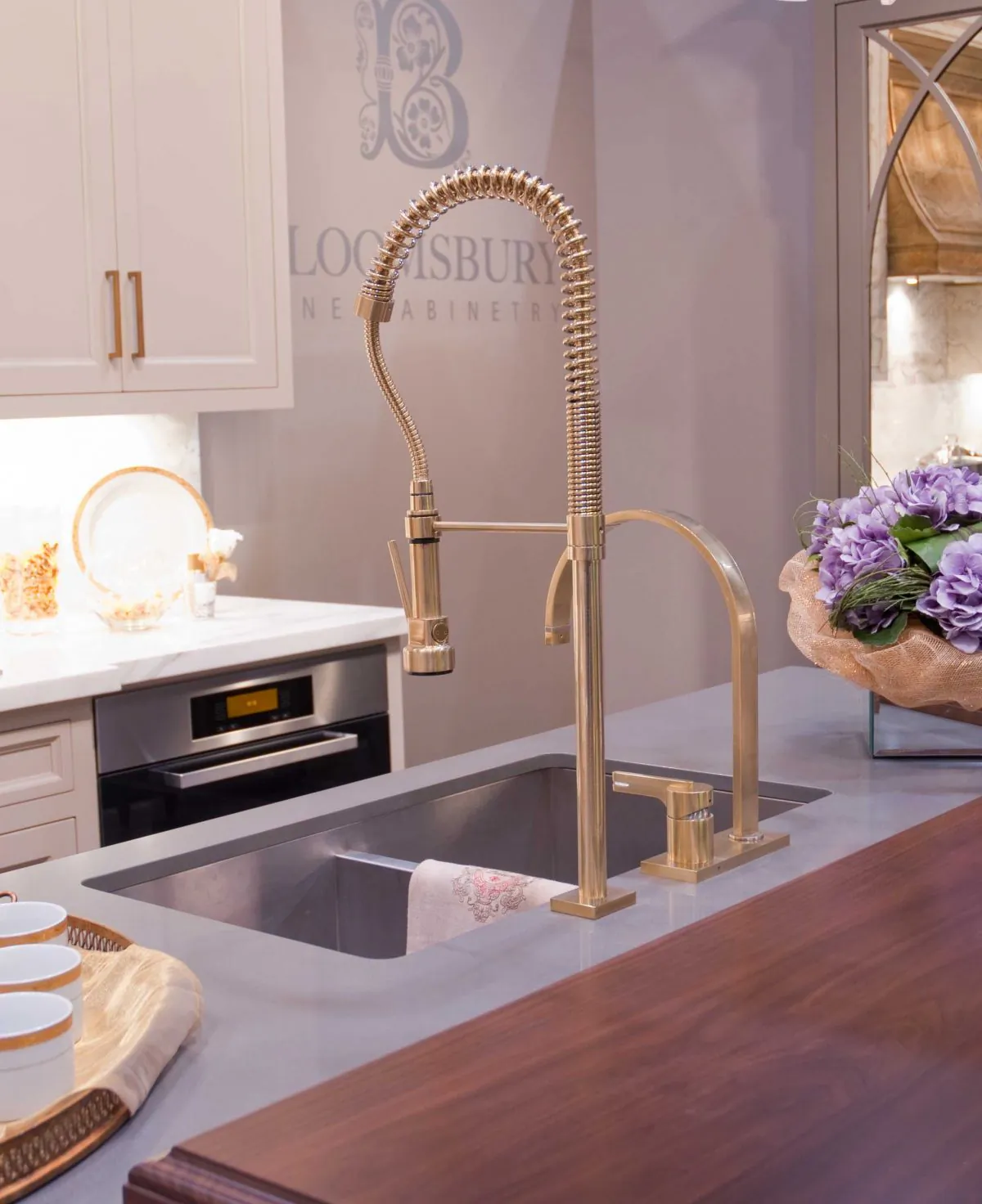 There are many ways to add small touches of gold in your home. (Bloomsbury Fine Cabinetry)