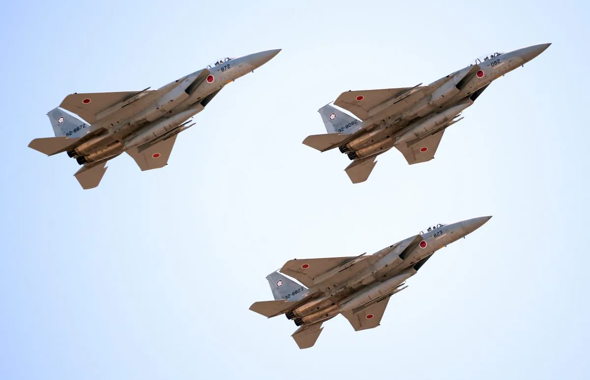 Japanese F-15 jets fly during the military review at the Ground Self-Defense Force's Asaka training ground on Oct. 27. China created an air defense zone in the East China Sea, which requires foreign jets to cooperate with Chinese authorities. (Toru Yamanaka/AFP/Getty Images) 