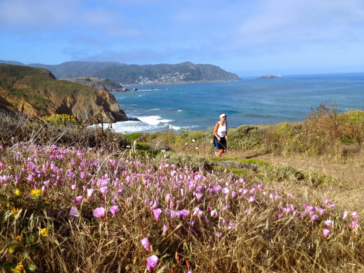 A trail runner enjoys the weather and view at Mori Point, near Pacifica and San Bruno. (Carol Camacho)