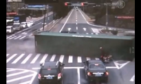 Motorcyclist Narrowly Escapes Overturning Truck in China (Video)
