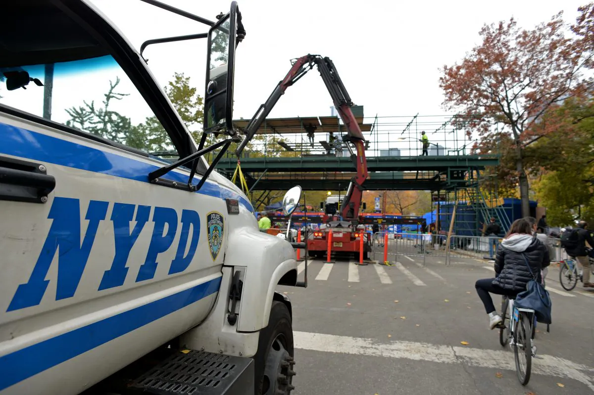 An NYPD vehicle watches over preparations for the New York Marathon. After the tragedy at the Boston Marathon, security will be tight for the New York event on Nov. 3. (Stan Honda/AFP/Getty Images)