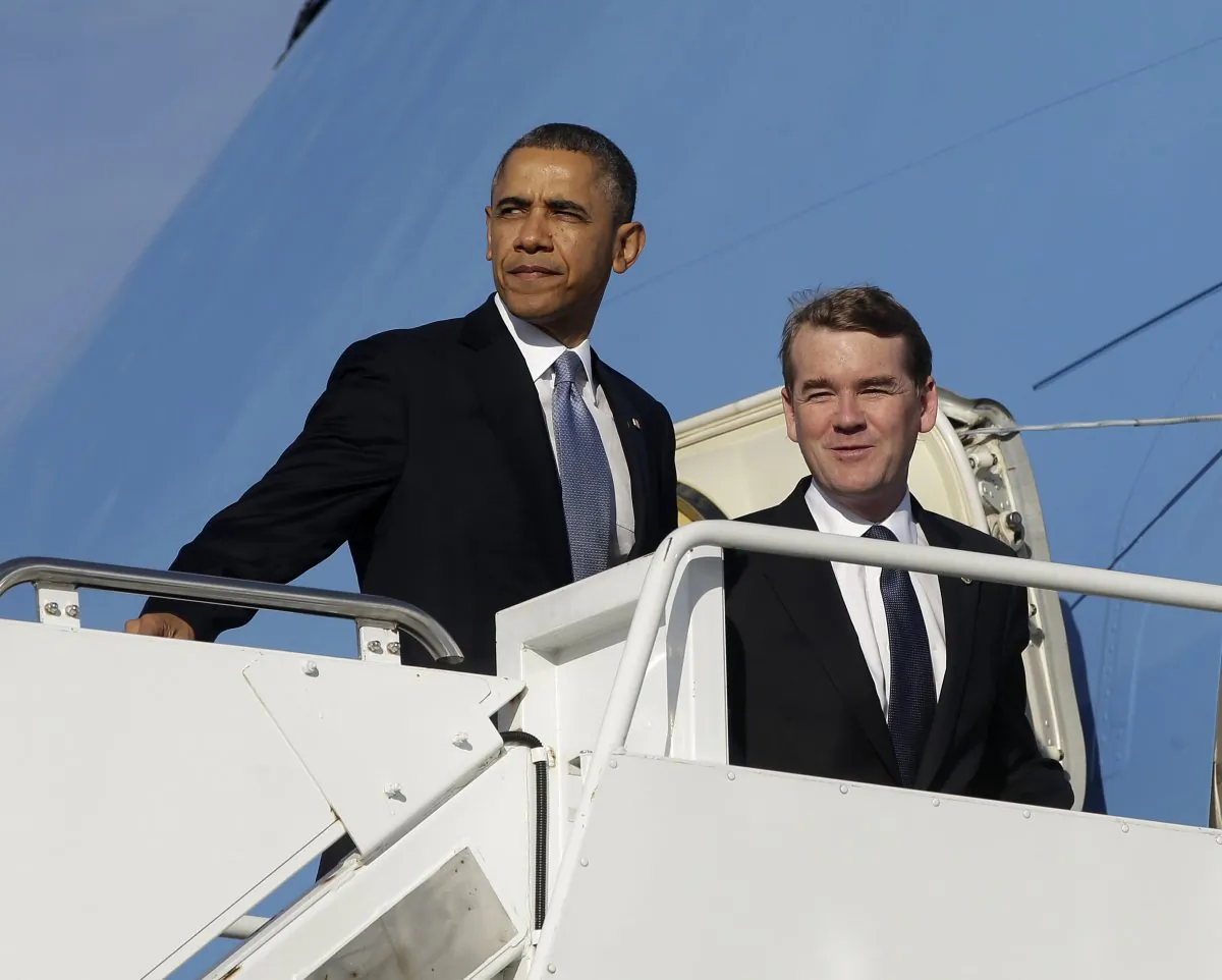 President Barack Obama and Democratic Senatorial Campaign Committee Chairman Sen. Michael Bennet, (D-Colo.) board Air Force One at Andrews Air Force Base, Md., Nov. 6. (Pablo Martinez Monsivais/AP)