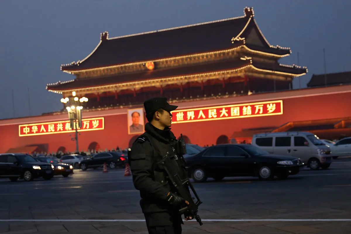 An anti-terror police officer patrols with his gun on Tiananmen Square on Nov. 8, 2013, in Beijing, China, part of the security in place for the Chinese Communist Partys the Third Plenary Session of the 18th Central Committee. At the plenum, which meets from Nov. 9 to 12, significant reforms are expected to be introduced. (Feng Li/Getty Images)