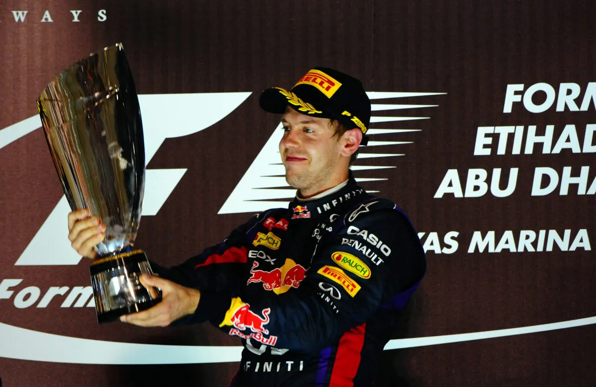 Red Bull Racing's Sebastian Vettel celebrates on the podium after winning the Formula One Abu Dhabi Grand Prix on November 3, 2013, at the Yas Marina circuit in Abu Dhabi. (Tom Gandolfini/AFP/Getty Images)