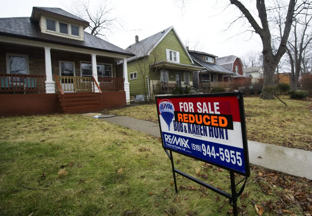 The price of a home is reduced for sale in Windsor, Ont., in a file photo. (The Canadian Press/Nathan Denette)