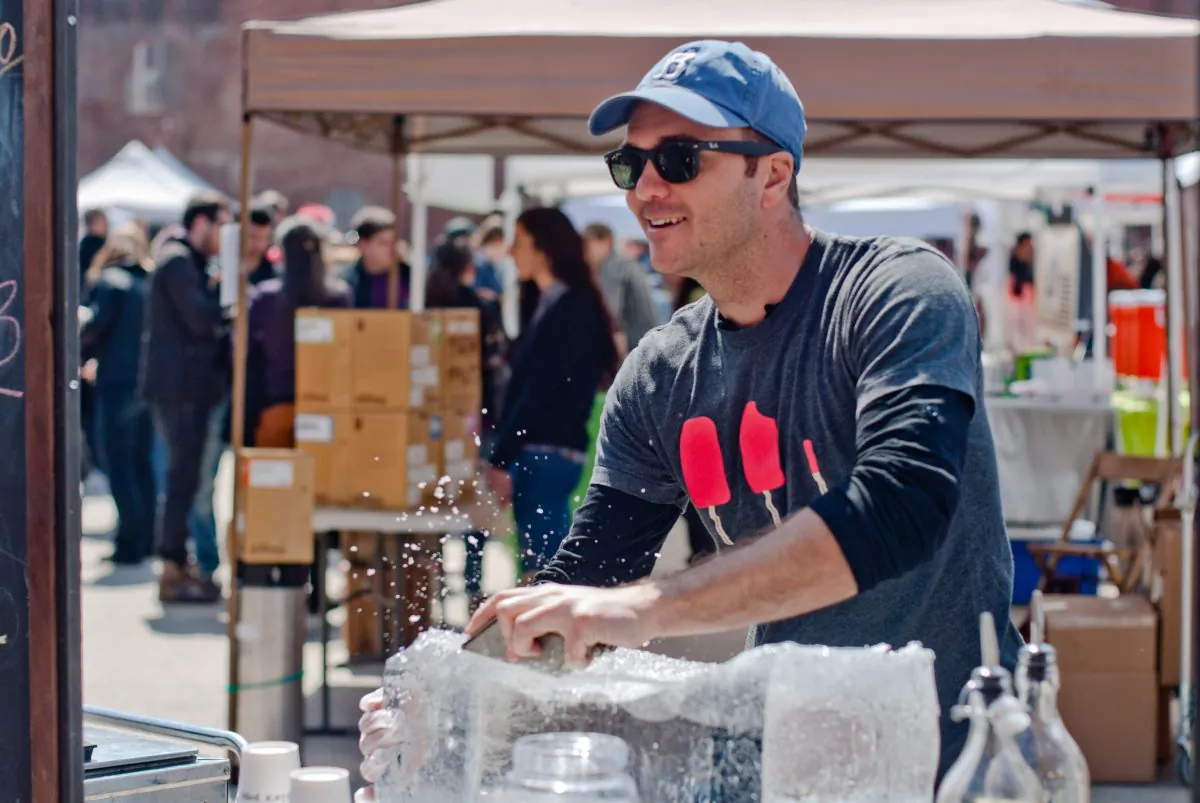 Ashley from People's Pops shaving ice at Smorgasburg this spring. (Joshua Philipp/Epoch Times)