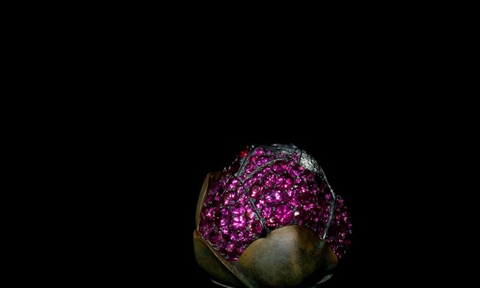 JAR Camellia Brooch (2010). Rubies, pink sapphires, diamonds, silver, and gold. Private collection Photograph by Jozsef Tari. (Courtesy of JAR, Paris)