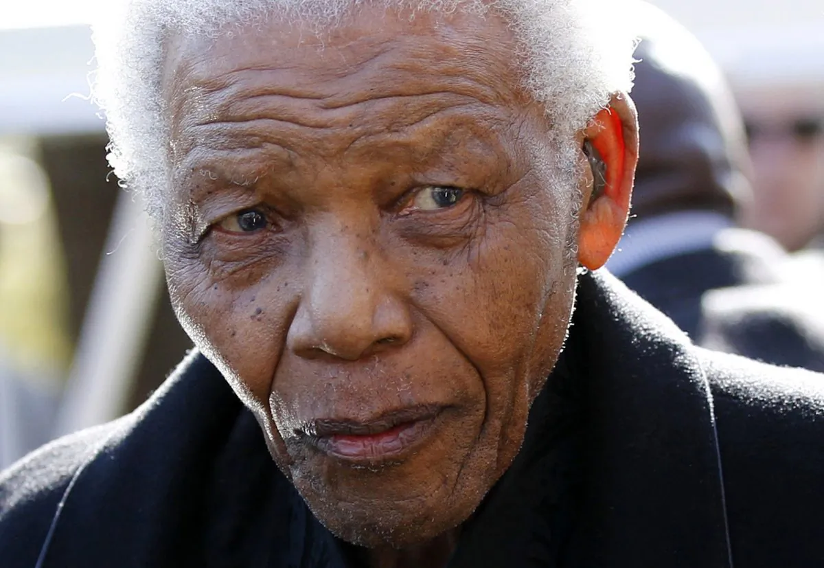 Former South African President Nelson Mandela arrives for the funeral of his great-granddaughter Zenani Mandela at St Stithian?s College Chapel in Sandton, north of Johannesburg  on June 17, 2010. Thirteen-year-old Zenani Mandela was killed in a car that overturned on June 10 as it took her home from a pre-World Cup concert in Soweto. (Siphiwe SibekoAFP/Getty Images)