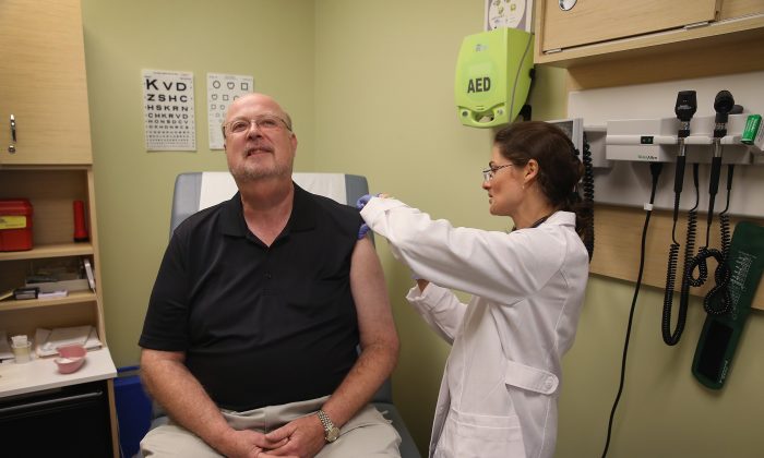 A file photo of a man receiving a flu shot. (Scott Olson/Getty Images)