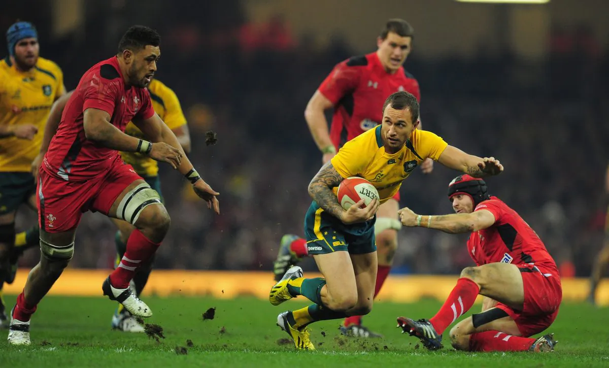 Quade Cooper of the Australia Wallabies spots a gap and leaves Leigh Halfpenny of Wales grasping at thin air during their match at Millennium Stadium in Cardiff on Nov 30, 2013. (Stu Forster/Getty Images)