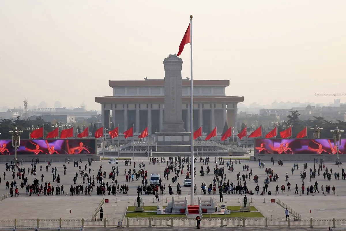 Tourists visit Tiananmen Square on Nov. 14, 2013, in Beijing, China. On Jan. 23, 2001, the Chinese regime staged “self-immolations” by alleged Falun Gong practitioners and then featured video of the fabricated event in propaganda attacking the group. (Feng Li/Getty Images)