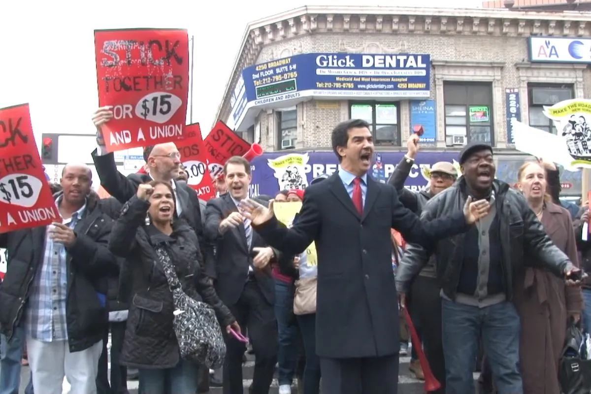 New York City Council member Ydanis Rodriguez joins protesters outside a McDonald's on 181st Street, calling for higher wages, in New York, Dec. 5, 2013. (Seth Hirsch) 