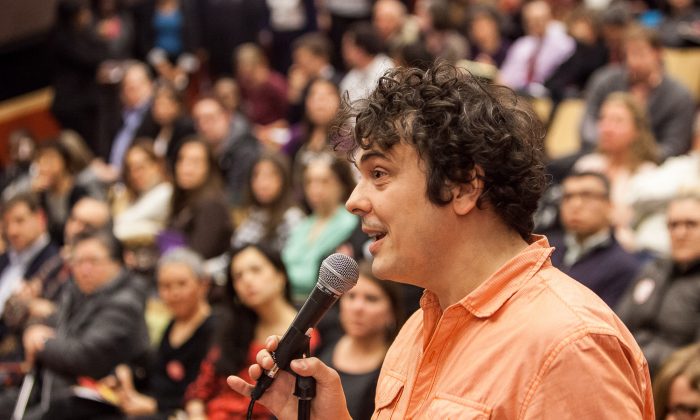 Marco Batistella, a parent who opted his child out from fourth-grade math and English tests, speaks at a community forum on Common Core at the Spruce Street School, Manhattan, New York, Dec. 11, 2013. (Petr Svab/Epoch Times)