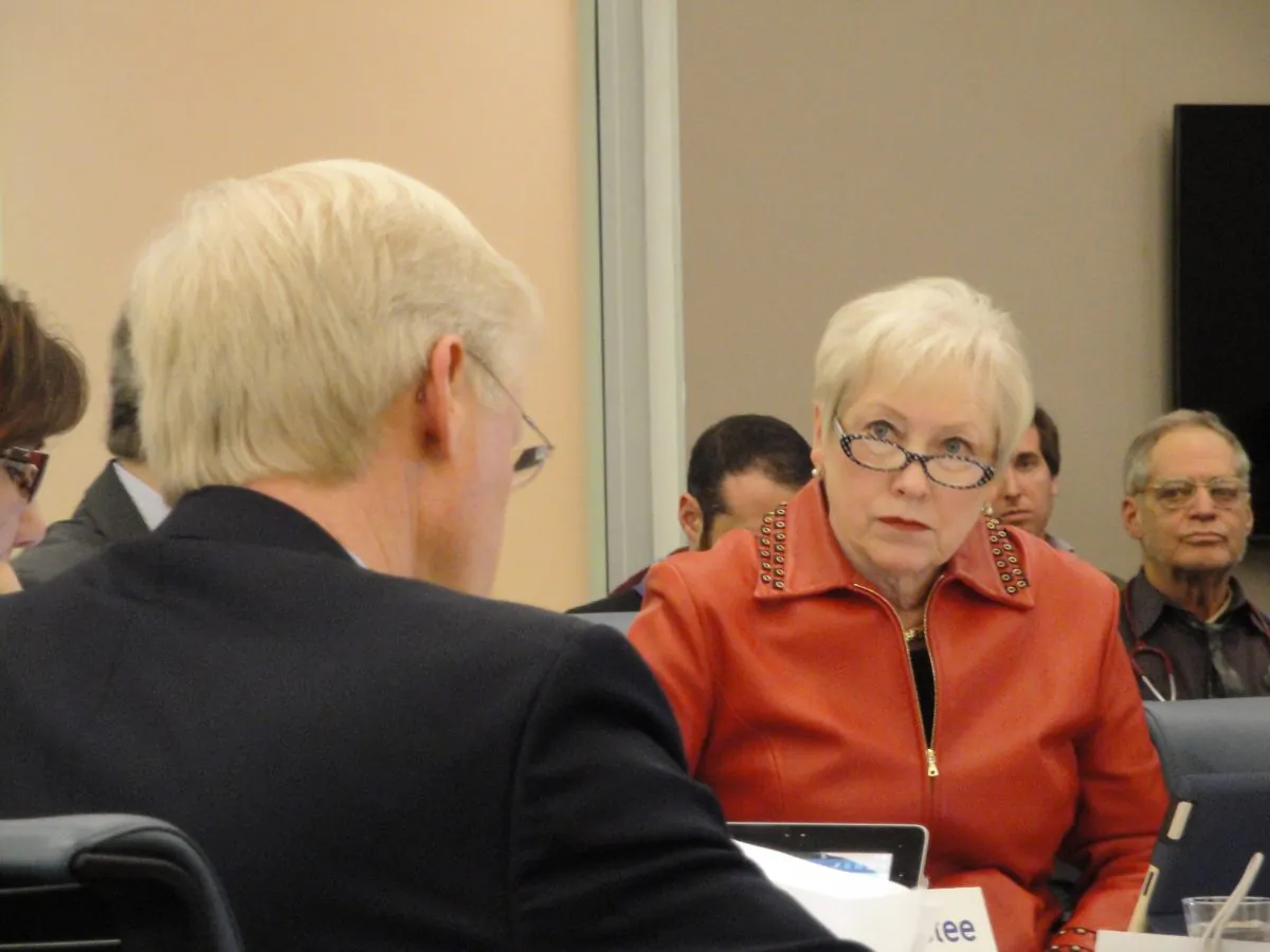 State University of New York (SUNY) chancellor Nancy Zimpher listens to SUNY trustee John Murad speak at a board meeting in Manhattan on Dec. 17, 2013. (Sarah Matheson/Epoch Times)