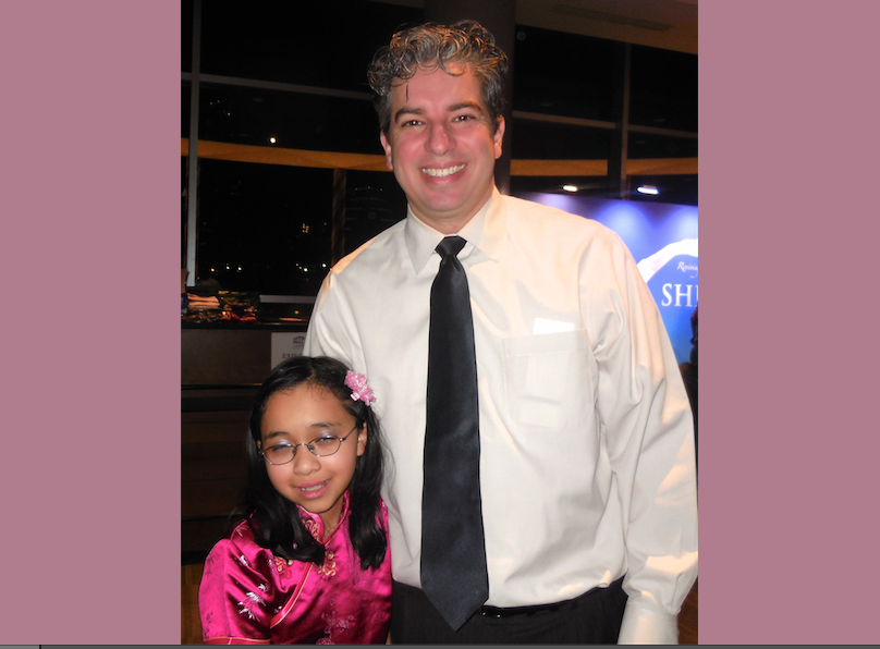Shawn Dick brought his young daughter to experience Shen Yun Performing Arts at the Long Center for the Performing Arts, on Dec. 28. (Stacy Chen/Epoch Times)