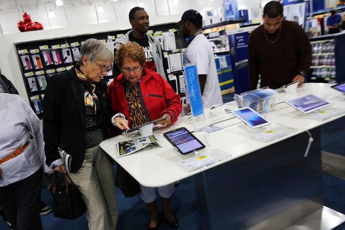 Two women shop for iPads at a Best Buy store in Naples, Fla., on Nov. 29, 2013. Despite their earning power, baby boomers are overlooked in business marketing plans. (Spencer Platt/Getty Images)