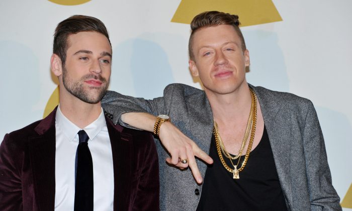 Ryan Lewis, left, and Macklemore pose backstage at the Grammy Nominations Concert Live! on Friday, Dec. 6, 2013, at the Nokia Theatre L.A. Live in Los Angeles. (Photo by Richard Shotwell/Invision/AP)