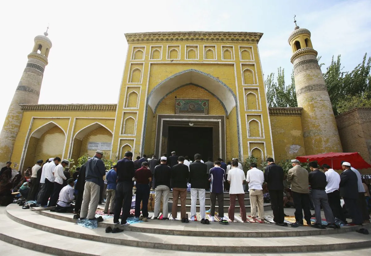 Muslims pray outside a mosque on September 22, 2006 in Kashi of Xinjiang Uygur Autonomous Region, northwest China. Kashi is an oasis city which has been noted in ancient times along the old silk road as a political and commercial centre. It is the hub of an important commercial district, bordering Russia, Afghanistan, Kazakhstan, Tajikistan, Kyrgyzstan and Uzbekistan with Pakistan to its south. The Islamic Uygur ethnic minority group constitutes the majority of its population. (China Photos/Getty Images)