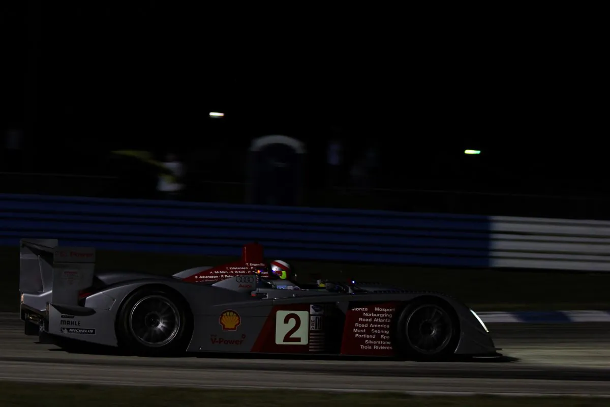 Travis Engen’s 2005 Audi R8 has a list of its endurance accomplishments on its fender; add to that the HSR Sebring 2013 Night Race. (Chris Jasurek/Epoch Times)