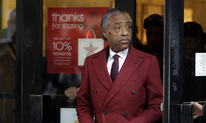 The Rev. Al Sharpton leaves Macy's flagship store, in New York, after a meeting with the CEO of Macy's to talk about racial profiling, Nov. 4, 2013. It follows an incident in which a leading actor on the HBO series "Treme" was detained by police after buying his mother an expensive watch. (Richard Drew/AP)