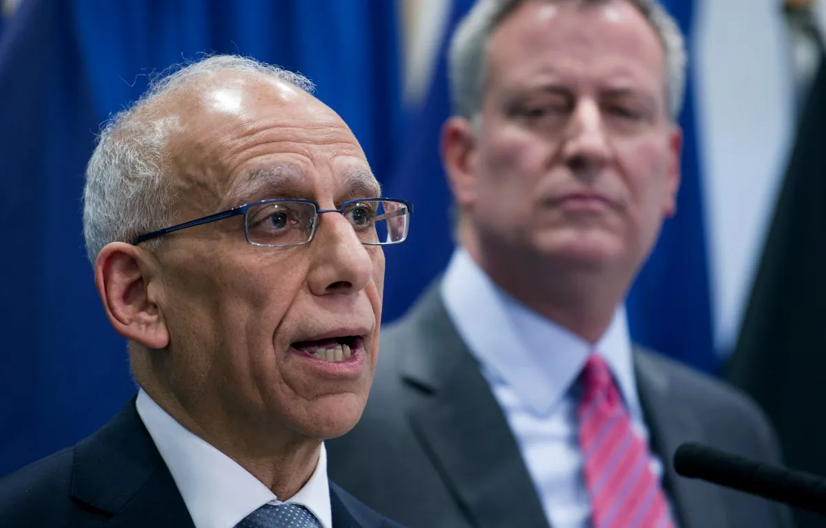 Dean Fuleihan (L) speaks after being announced as the new budget director of New York City by Mayor-elect Bill de Blasio, at New York City College of Technology, New York, Dec. 18, 2013. (Craig Ruttle/AP)