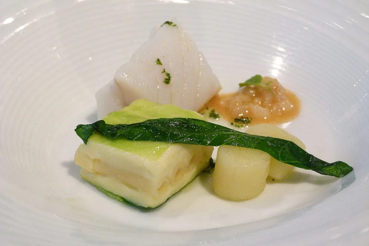 Cod pot-au-feu, potato gnocchi, cabbage and brandade terrine and cod tripe. (Courtesy of Manos Angelakis)