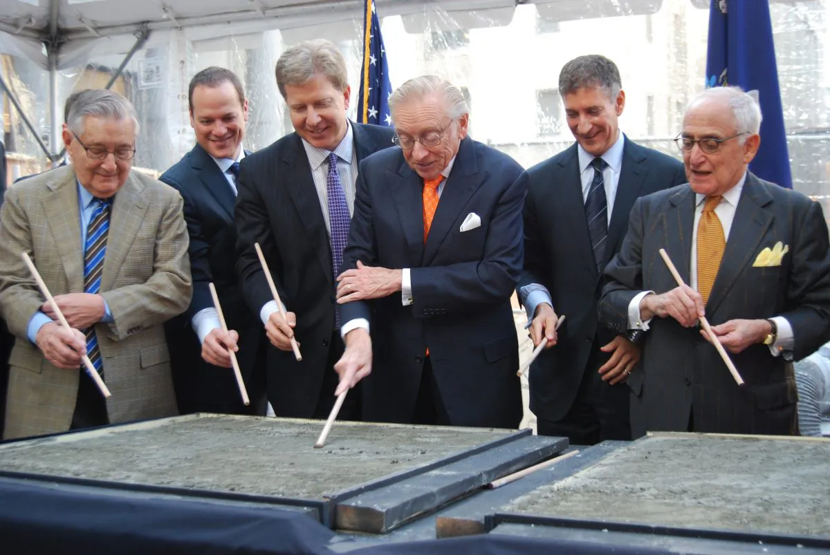 Larry Silverstein signs his name in a concrete plate at the ceremonial groundbreaking for 30 Park Place, Downtown Manhattan, New York, Dec. 3, 2013. (Catherine Yang/Epoch Times)