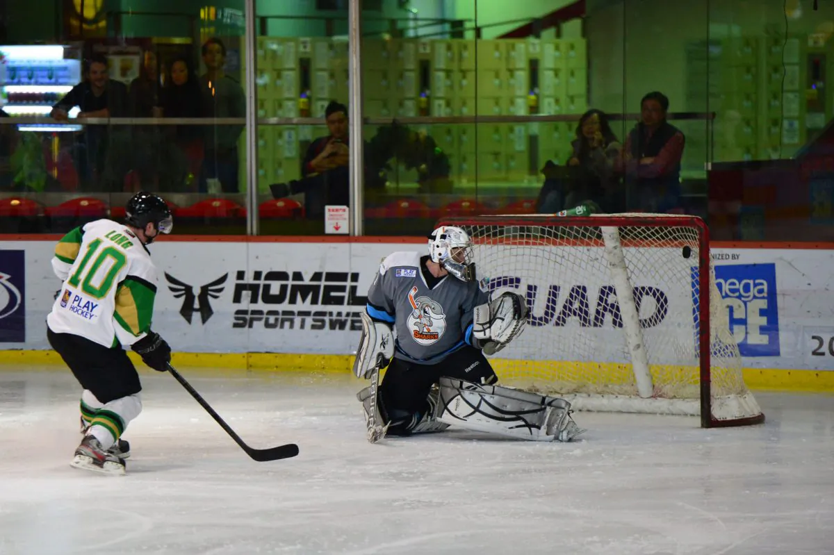 Christian Long extends the Macau Aces lead to 5-3 in their match with the South China Sharks in the CIHL at Mega Ice on Saturday Dec 7, 2013. (Bill Cox/Epoch Times)
