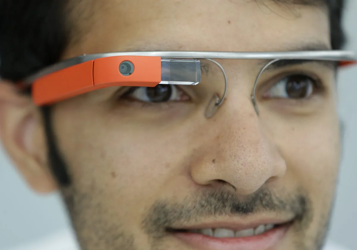 Google Glass team member Salil Pandit wears Google Glasses at a booth at Google I/O 2013 in San Francisco, Wednesday, May 15, 2013. (AP Photo/Jeff Chiu)